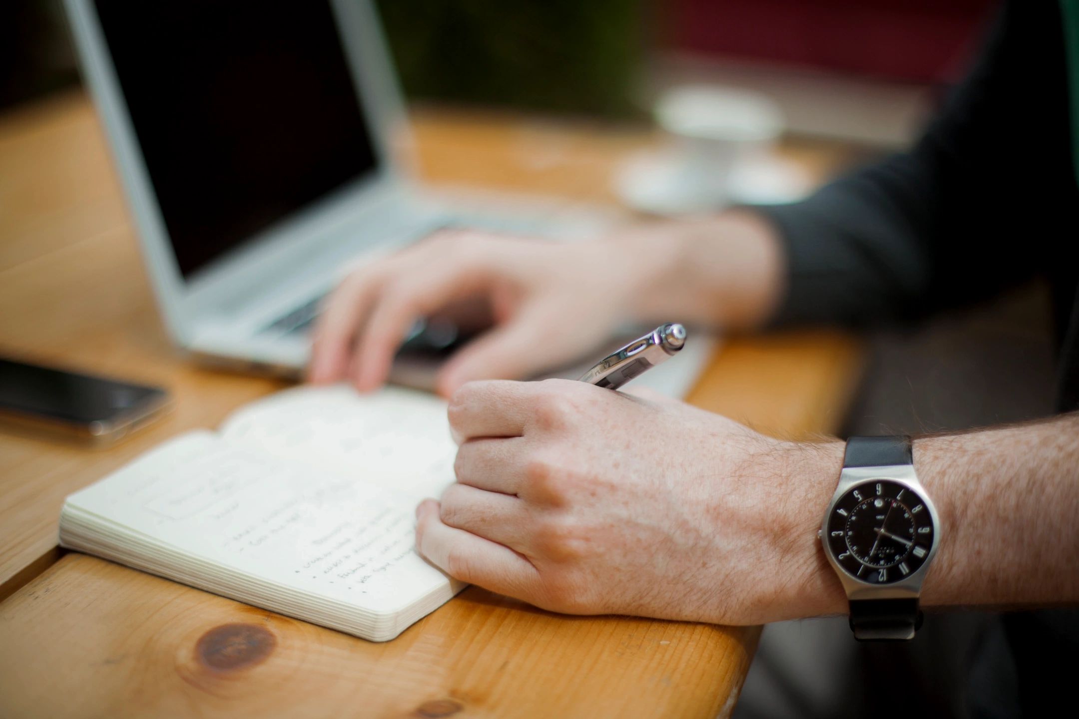 man drafting notes